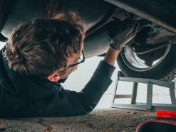 man fixing vehicle engine 2244746